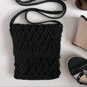 Black macramé crossbody with black lining and  zip closure.